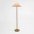 Elegant brass floor lamp with a slim, minimalist design and a wide conical fabric shade. The lamp features a sleek gold-tone metal base, offering a warm and sophisticated lighting solution for modern interiors.