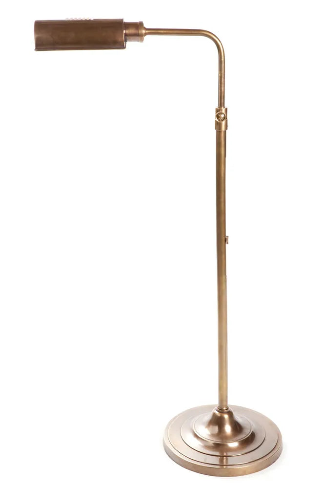 Vintage brass adjustable desk lamp with a round base and a sleek, curved arm. The lamp features a cylindrical shade with a brushed brass finish, perfect for adding a touch of elegance to a workspace or reading nook.